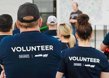 WillScot Mobile Mini volunteers wearing a volunteer shirt